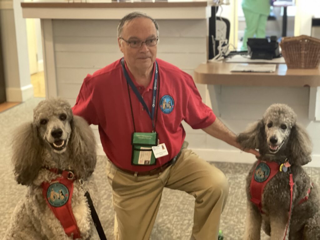 Therapy Dog volunteers Bentley and Jackson and their human Robert